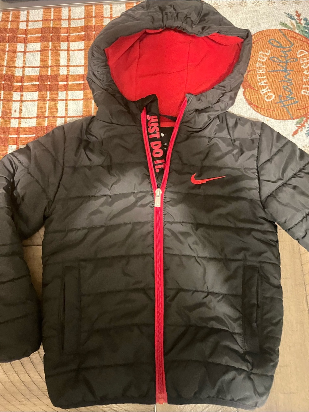 Nike Kids Black Puffer Jacket with Red Trim and Hood